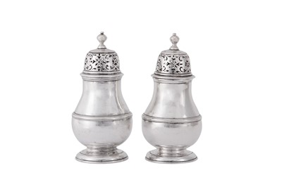 Lot 2 - A pair of George I Britannia standard silver pepper casters, London 1714 by Samuel Welder (first reg. 4th Aug 1714)
