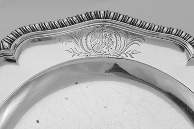 Lot 14 - A pair of George II sterling silver dinner plates, London 1758 by Edward Wakelin (reg. 17th Nov 1747)