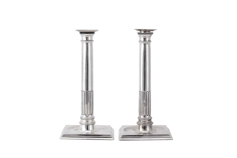 Lot 117 - A pair of early George III sterling silver Neoclassical candlesticks, London 1761 by Ebenezer Coker (reg. 27th March 1738)