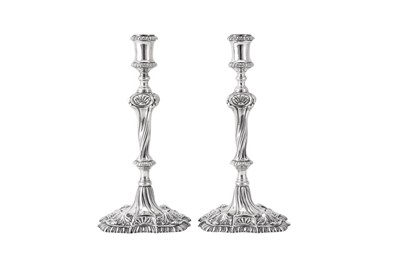 Lot 119 - A pair of George III Irish cast sterling silver candlesticks, Dublin circa 1765-70 by Richard Williams