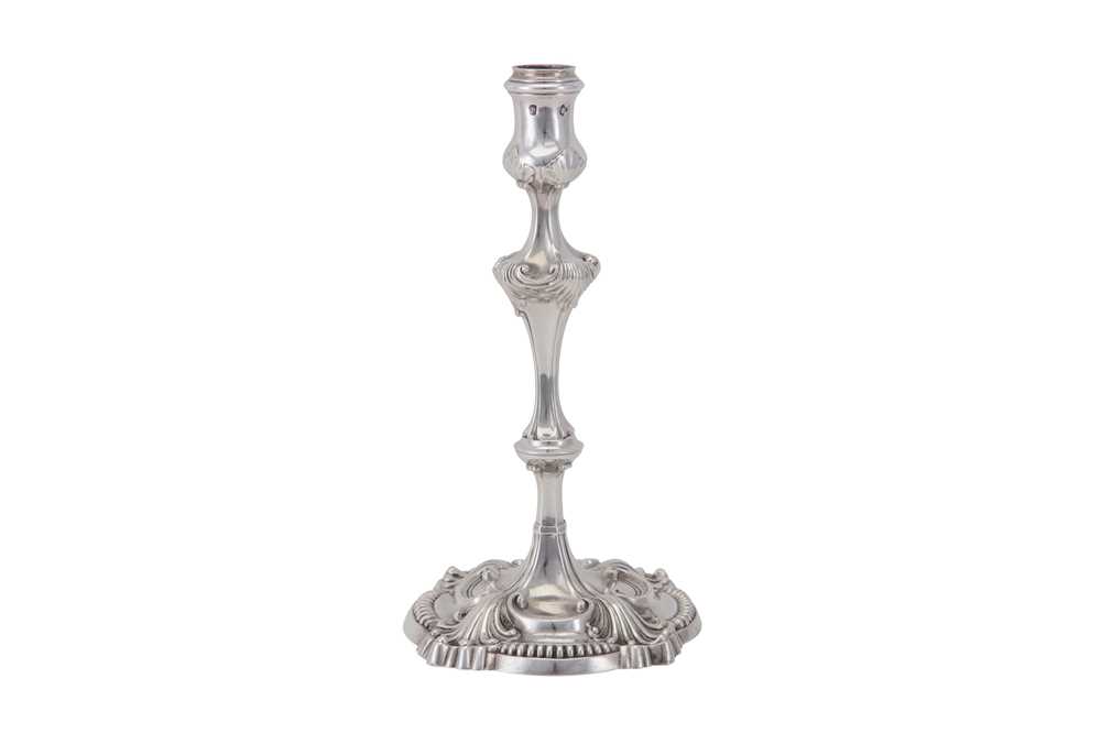 Lot 109 - An early George III sterling silver cast candlestick, London 1763 by Thomas Heming (reg. 12th June 1745)