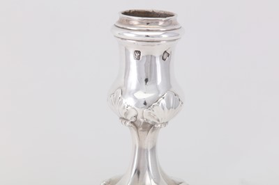Lot 109 - An early George III sterling silver cast candlestick, London 1763 by Thomas Heming (reg. 12th June 1745)