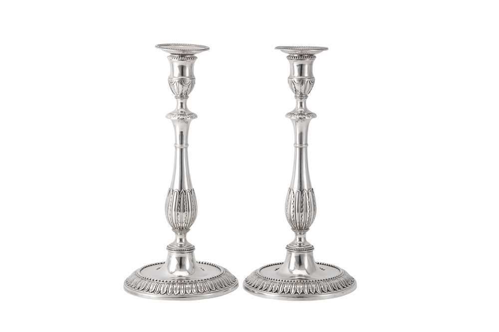 Lot 118 - A pair of George III sterling silver candlesticks, London 1777 by Robert Makepeace and Richard Carter (reg. 20th January 1777)