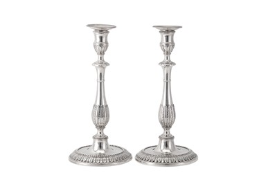 Lot 118 - A pair of George III sterling silver candlesticks, London 1777 by Robert Makepeace and Richard Carter (reg. 20th January 1777)