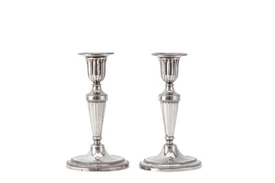 Lot 33 - A rare pair of George III sterling silver diminutive or library candlesticks, London 1782 by John Scofield (reg. 13th Jan 1778)