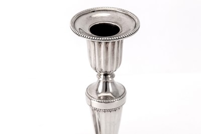 Lot 33 - A rare pair of George III sterling silver diminutive or library candlesticks, London 1782 by John Scofield (reg. 13th Jan 1778)