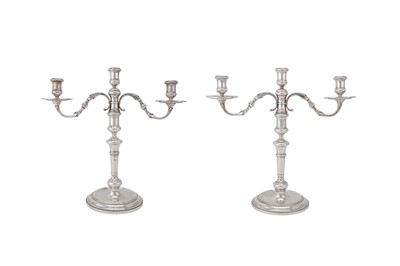 Lot 99 - A pair of Elizabeth II sterling silver three-light candelabra, London 1962 by Apsrey and Co