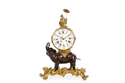 Lot 16 - A LOUIS XV STYLE GILT AND PATINATED BRONZE...
