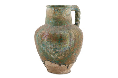 Lot 113 - A BLACK-PAINTED TURQUOISE-GLAZED WATER JUG...