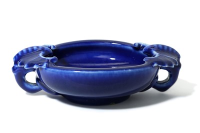Lot 480 - A CHINESE BLUE-GLAZED CIRCULAR 'BAT' BRUSH...
