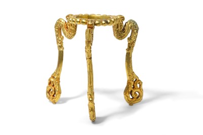 Lot 106 - A CHINESE GILT-BRONZE 'DRAGON' TRIPOD STAND....