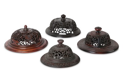 Lot 368 - FOUR CHINESE WOOD JAR COVERS.