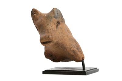 Lot 64 - A NEOLITHIC GREEK PROTOME OF A BULL Circa 5th...
